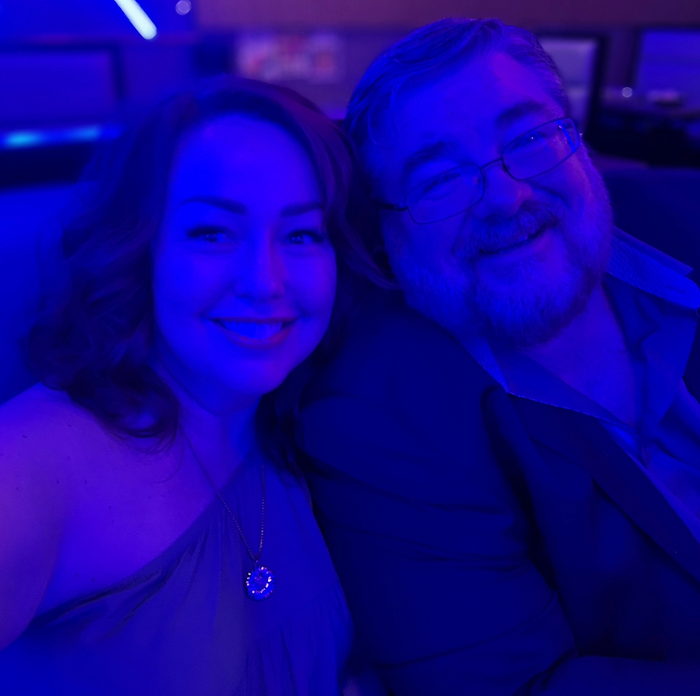 Me and Scott recently having dinner with three of our four children (at a restaurant with neon lighting!).